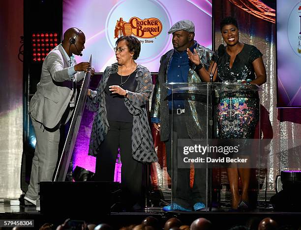 Actor/comedian Lavell Crawford and radio personality Carla Ferrell present the "Best Teacher Award" during the 2016 Neighborhood Awards hosted by...