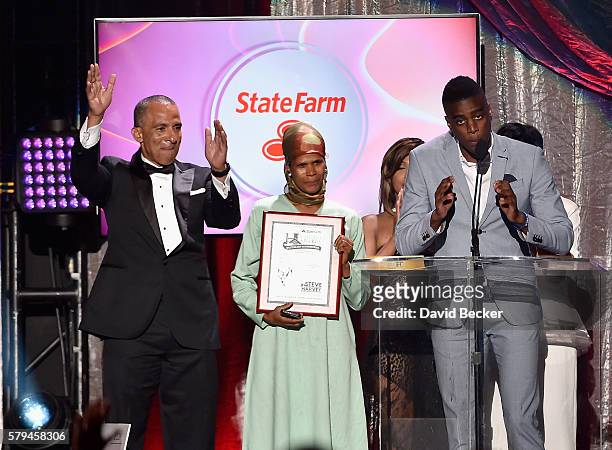 State Farm Mutual Automobile Insurance Company Executive VP and Chief Administrative Officer Duane Farrington and recipient of the "Good Neighbor...
