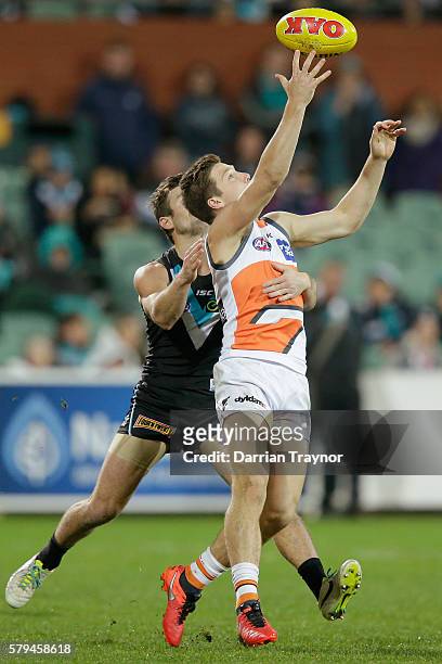 Toby Greene of the Giants gathers the ball during the round 18 AFL match between the Port Adelaide Power and the Greater Western Sydney Giants at...