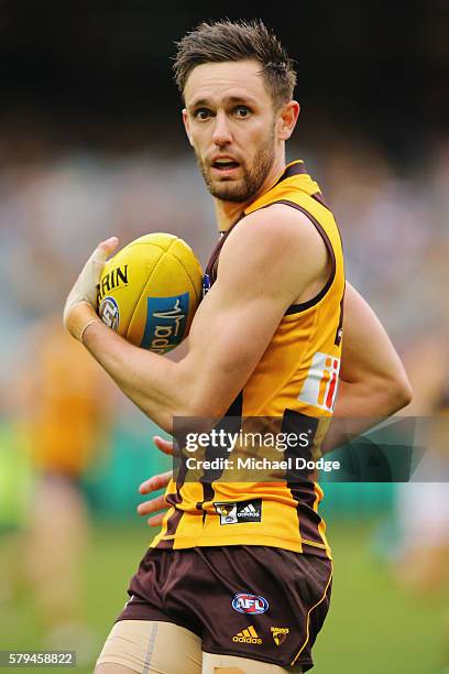 Jack Gunston of the Hawksh looks upfield during the round 18 AFL match between the Hawthorn Hawks and the Richmond Tigers at Melbourne Cricket Ground...