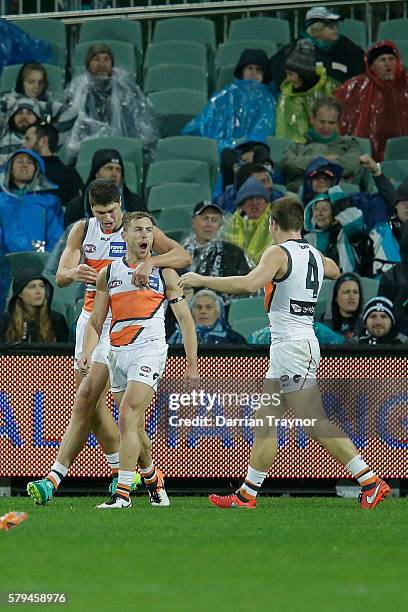 Devon Smith of the Giants celebrates a goal during the round 18 AFL match between the Port Adelaide Power and the Greater Western Sydney Giants at...