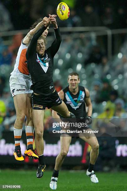 Phil Davis of the Giants spoils the ball during the round 18 AFL match between the Port Adelaide Power and the Greater Western Sydney Giants at...