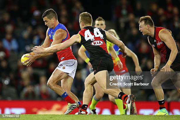 Tom Rockliff of the Lions competes for the ball during the round 18 AFL match between the Essendon Bombers and the Brisbane Lions at Etihad Stadium...