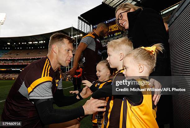 Sam Mitchell of the Hawks greets his children and wife Lyndall during the 2016 AFL Round 18 match between the Hawthorn Hawks and the Richmond Tigers...