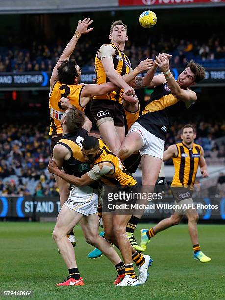 Jordan Lewis of the Hawks, Jack Riewoldt of the Tigers, Josh Gibson of the Hawks, Kaiden Brand of the Hawks and Liam McBean of the Tigers compete for...