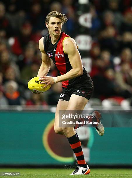 Joe Daniher of the Bombers runs with the ball during the round 18 AFL match between the Essendon Bombers and the Brisbane Lions at Etihad Stadium on...