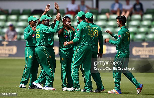 Bilawal Bhatti of Pakistan celebrates with team mates after taking the wicket of Dawid Malan of England during the Triangular Series match between...