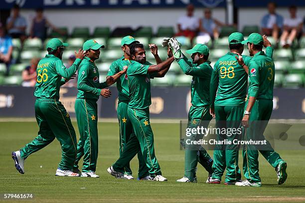 Bilawal Bhatti of Pakistan celebrates with team mates after taking the wicket of Dawid Malan of England during the Triangular Series match between...
