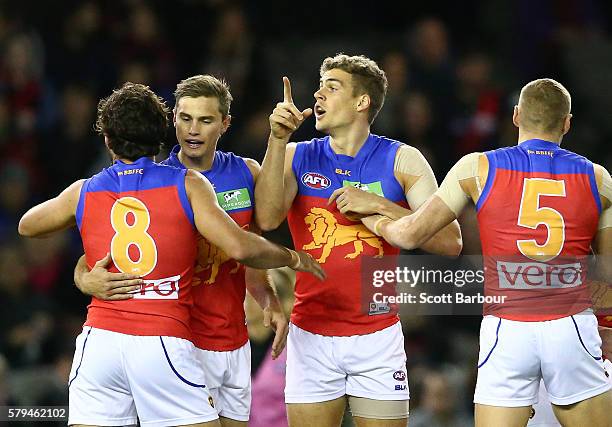 Tom Cutler of the Lions celebrates after kicking a goal during the round 18 AFL match between the Essendon Bombers and the Brisbane Lions at Etihad...