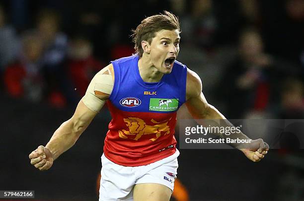 Liam Dawson of the Lions celebrates after kicking a goal during the round 18 AFL match between the Essendon Bombers and the Brisbane Lions at Etihad...