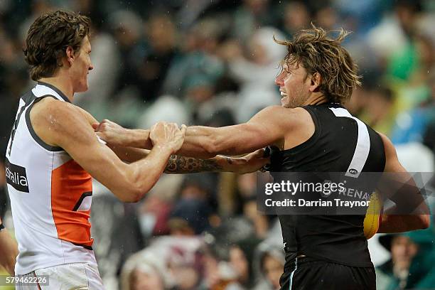 Brad Ebert of the Power wrestles with Rory Lobb of the Giants during the round 18 AFL match between the Port Adelaide Power and the Greater Western...