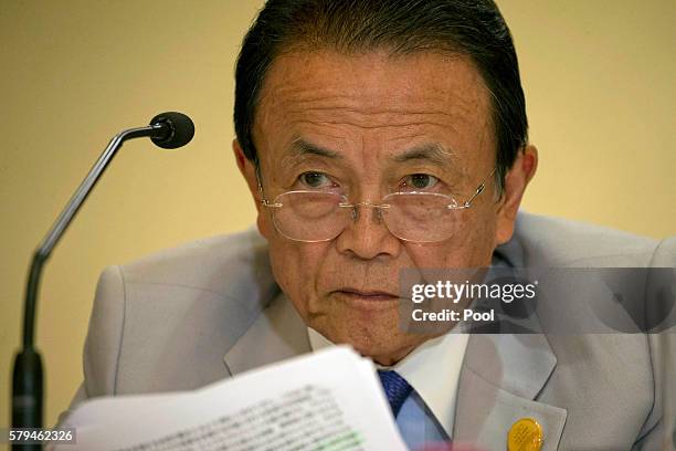 Japan's Deputy Prime Minister Taro Aso attends a press conference held at the close of the G20 Finance Ministers and Central Bank Governors meeting...