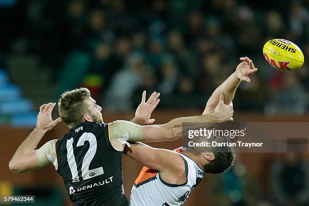 Jackson Trengove of the Power and Shane Mumford of the Giants compete in the ruck during the round 18 AFL match between the Port Adelaide Power and...