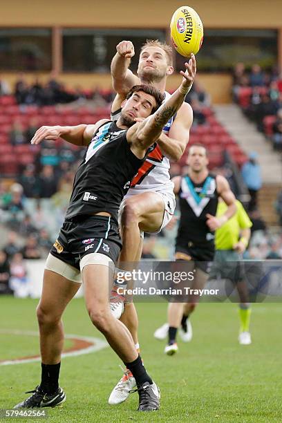 Joel Patfull of the Giants spoils Chad Wingard of the Power during the round 18 AFL match between the Port Adelaide Power and the Greater Western...
