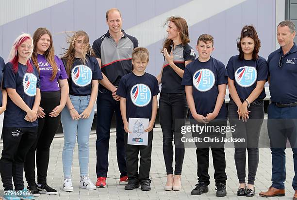 The Duke and Duchess of Cambridge pose with members of the 1851 Trust charity as they visit the Land Rover BAR at the America's Cup World Series on...