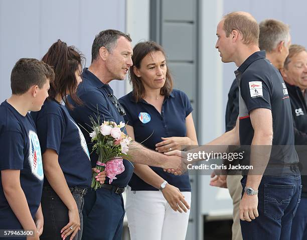 Prince William, Duke of Cambridge greets members of the 1851 Trust charity and CEO Jo Stocks as he visits the Land Rover BAR at the America's Cup...