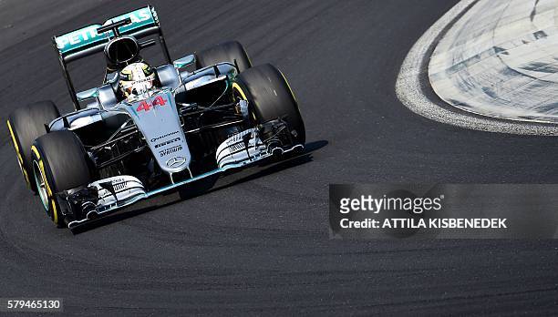Mercedes AMG Petronas F1 Team's British driver Lewis Hamilton races during the Formula One Hungarian Grand Prix at the Hungaroring circuit in...