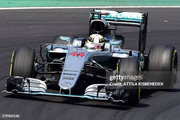 Mercedes AMG Petronas F1 Team's British driver Lewis Hamilton races during the Formula One Hungarian Grand Prix at the Hungaroring circuit in...