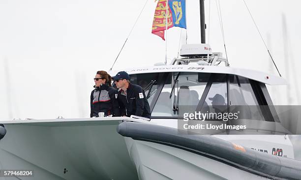 Catherine, Duchess of Cambridge and Prince William, Duke of Cambridge watch the race from onboard the LandRover BAR support boat during day 3 of the...