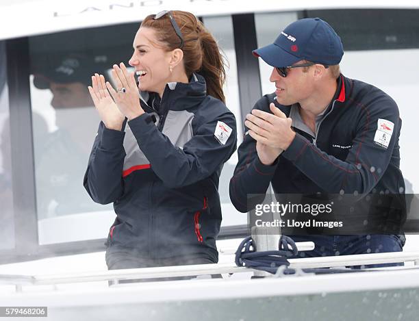 Catherine, Duchess of Cambridge and Prince William, Duke of Cambridge watch the race from onboard the LandRover BAR support boat during day 3 of the...