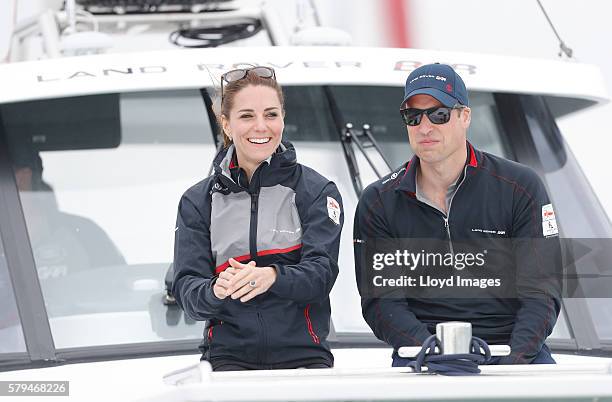 Catherine, Duchess of Cambridge and Prince William, Duke of Cambridge watch the race from onboard the LandRover BAR support boat during day 3 of the...