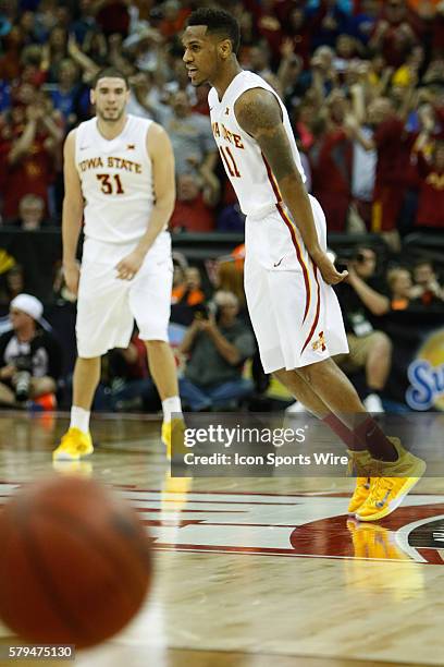 Iowa State guard Monte Morris reacts after making a three-point shot during the Thursday game between Iowa State and Texas in the Big 12 Tournament...