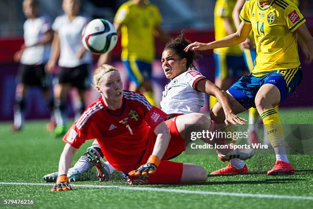Celia Sasic of Germany is taken down by Amanda Ilestedt of Sweden in the second half at the FIFA 2015 Women's World Cup Round of 16 match between...