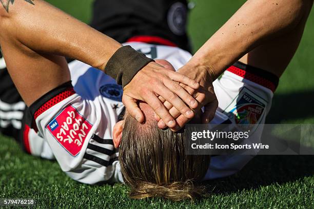 Simone Laudehr of Germany is in pain after being taken down during the FIFA 2015 Women's World Cup Round of 16 match between Germany and Sweden at...