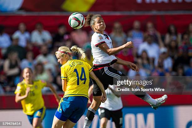 Celia Sasic of Germany heads the ball against Amanda Ilestedt of Sweden during the FIFA 2015 Women's World Cup Round of 16 match between Germany and...