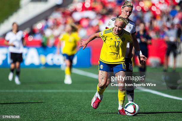 Caroline Seger of Sweden battles for the ball against /Alexandra Popp of Germany in the second half at the FIFA 2015 Women's World Cup Round of 16...