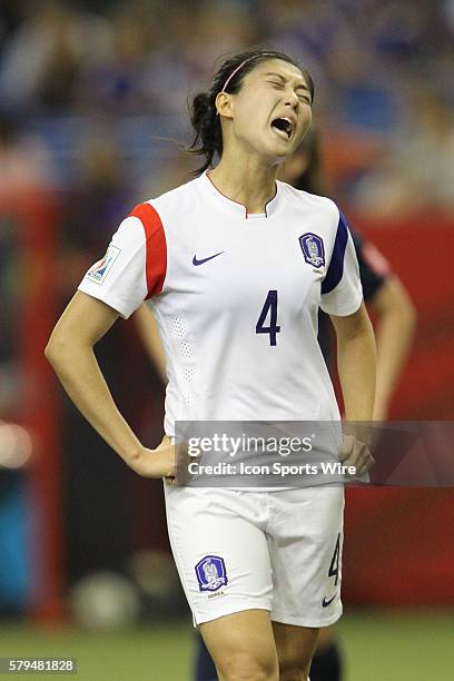 Seoyeon Shim of the Korea Republic reacts to a foul during the second half at the FIFA Women's World Cup 2015 Group of 16 match between France and...