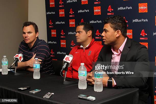 General Manager Ben Cherington of the Red Sox, international scouting director Eddie Romero and newly signed Yoan Moncada speaks to the media for the...