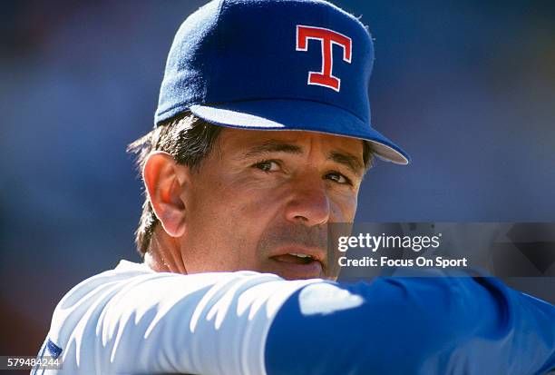 Manager Bobby Valentine of the Texas Rangers looks on from the dugout during an Major League Baseball spring training game circa 1992 at Municipal...