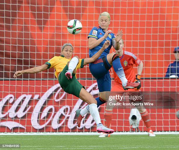 Australia's Kyah Simon does a bicycle kick towards goal as Sweden's Nilla Fischer blocks the shot at the FIFA Womens World Cup at Commonwealth...