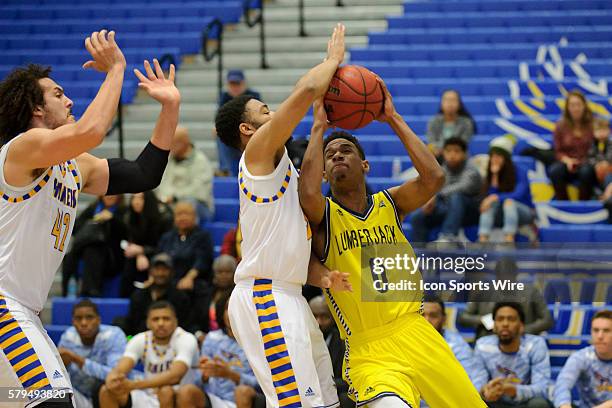 Northern Arizona Lumberjacks guard Torry Johnson drives to the basket with Cal State Bakersfield Roadrunners guard Justin Pride defending during the...