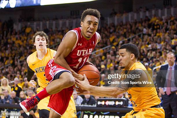 Utah Utes guard Brandon Taylor gets the ball stripped by Wichita State Shockers guard Fred VanVleet during the NCAA D1 mens basketball game between...