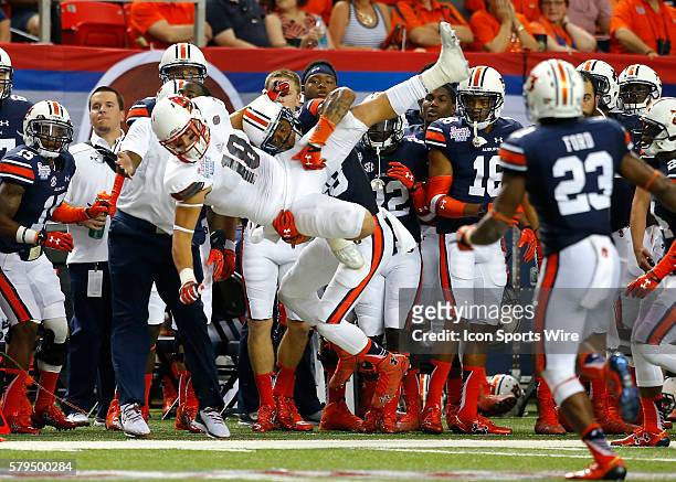 Louisville Cardinals tight end Cole Hikutini has the pass broken up by Auburn Tigers defensive back Tray Matthews in first half action of the Auburn...