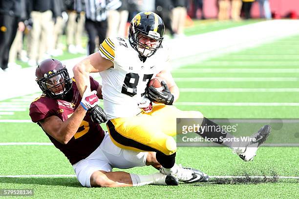 November 08, 2014 Gophers linebacker Damien Wilson tackles Hawkeyes Jake Duzey tight end during the third quarter at the Minnesota Gophers game...