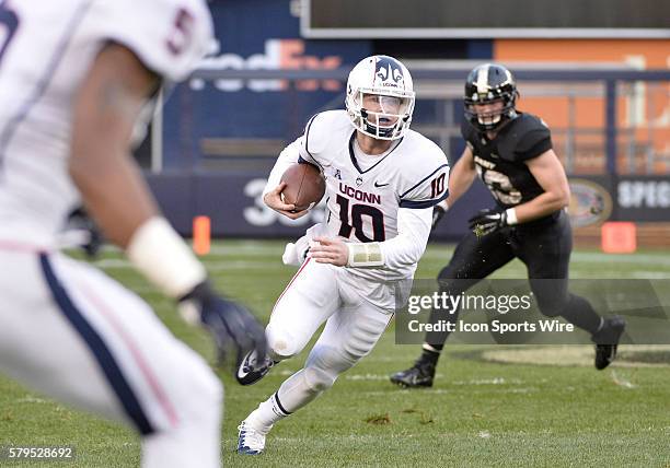 Saturday November 8, 2014: UConn Huskies quarterback Chandler Whitmer scrambles with the ball during the 1st half of a NCAA football game between...