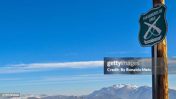 road sign on a post informing the presence of the chilean carabineros, the chilean police. - carabinieri stock-fotos und bilder