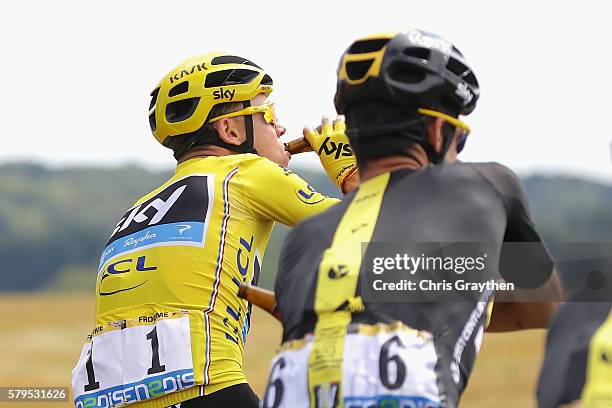 Chris Froome of Great Britain and Team Sky celebrates with his team by drinking beer during stage twenty one of the 2016 Le Tour de France, from...