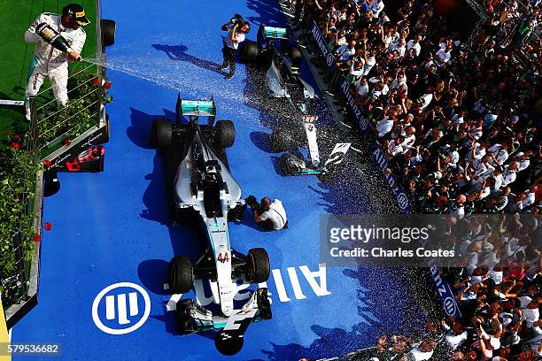 Lewis Hamilton of Great Britain and Mercedes GP celebrates his win on the podium during the Formula One Grand Prix of Hungary at Hungaroring on July...