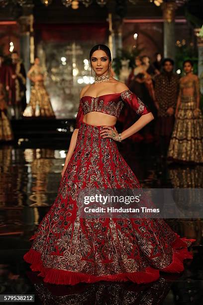 Bollywood actor Deepika Padukone walks the ramp for the Indian fashion Designer Manish Malhotra on day 1 of FDCI India Couture Week 2016 at The Taj...