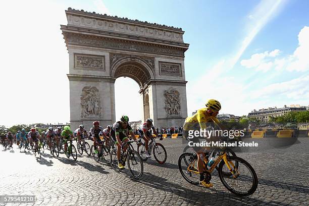 Chris Froome of Great Britain and Team Sky and the rest of the peloton cycle past The Arc de Triomphe during stage twenty one of the 2016 Le Tour de...