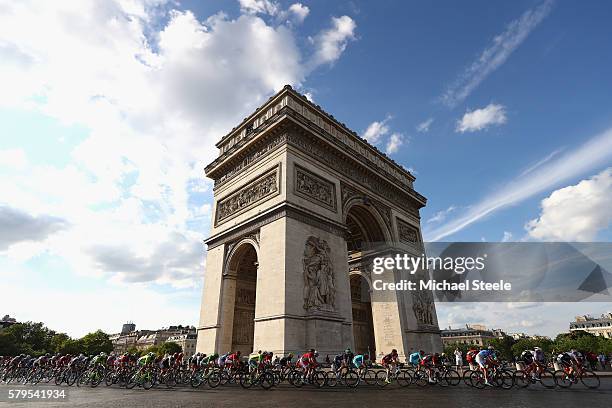 The peloton cycle past The Arc de Triomphe during stage twenty one of the 2016 Le Tour de France, from Chantilly to Paris Champs-Elysees on July 24,...