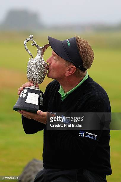 Paul Broadhurst of England poses with the trophy after the final round of the Senior Open Championship played at Carnoustie on July 24, 2016 in...