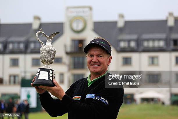 Paul Broadhurst of England poses with the trophy after the final round of the Senior Open Championship played at Carnoustie on July 24, 2016 in...