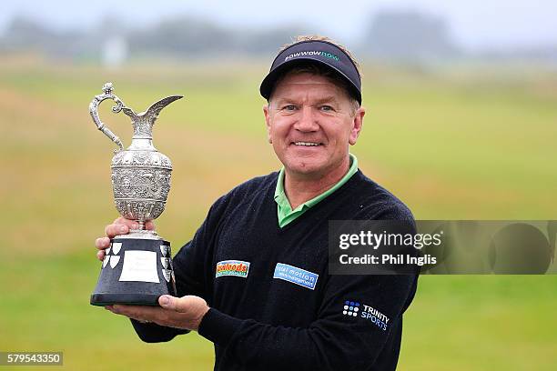 Paul Broadhurst of England poses with the trophy after the final round of the Senior Open Championship played at Carnoustie on July 24, 2016 in...