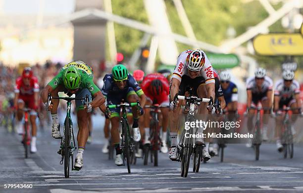 Andre Greipel of Germany and Lotto-Soudal beats Peter Sagan of Slovakia and Tinkoff as he crosses the finish line to win stage twenty one of the 2016...