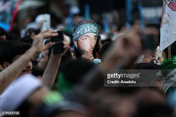 Photograph of leader of Hizbul Mujahideen Burhan Muzaffar Wani is seen during a protest, held against killing of Burhan Muzaffar Wani in Kashmir by...